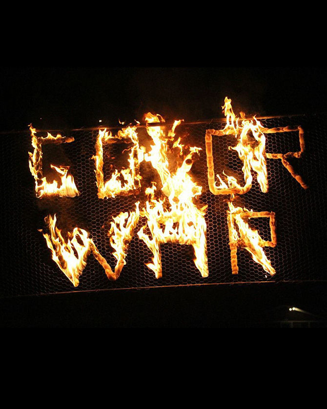 The flaming Color War sign burns brightly