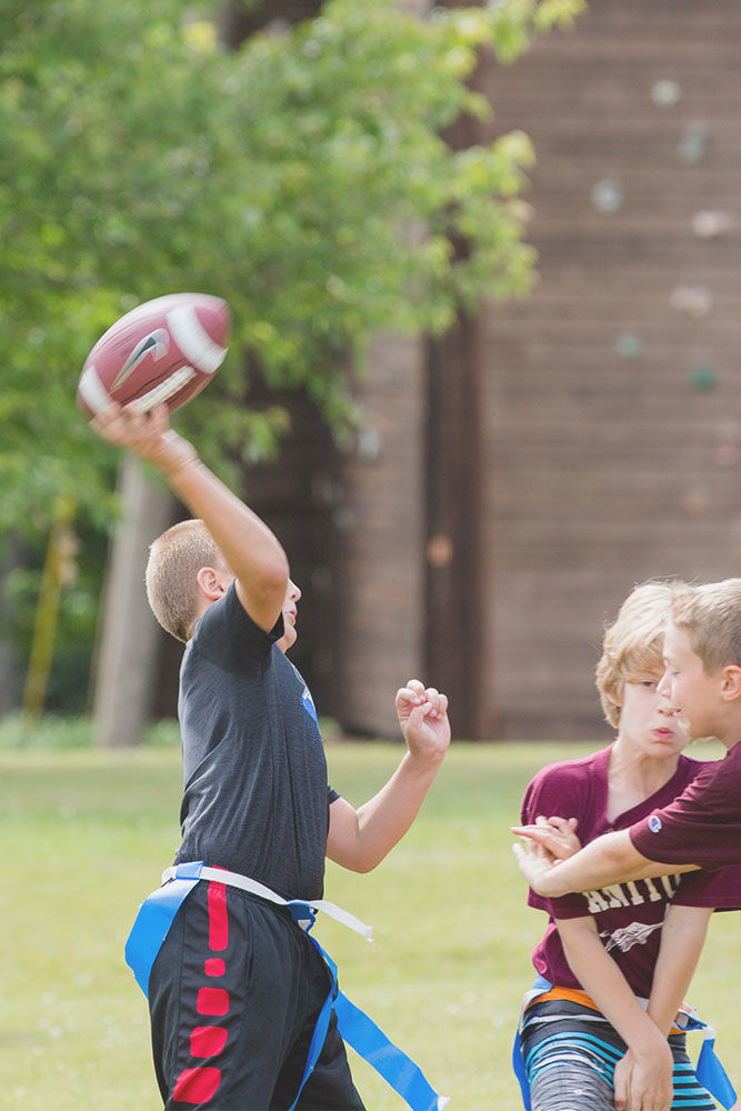 A camper passes the football just in time